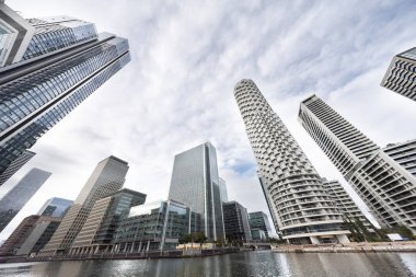 the skyline of canary wharf, london docklands, london england  clipart