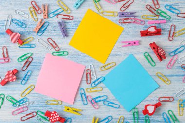 Multicolored different notes or sticky post-it on wooden office table background .mockup