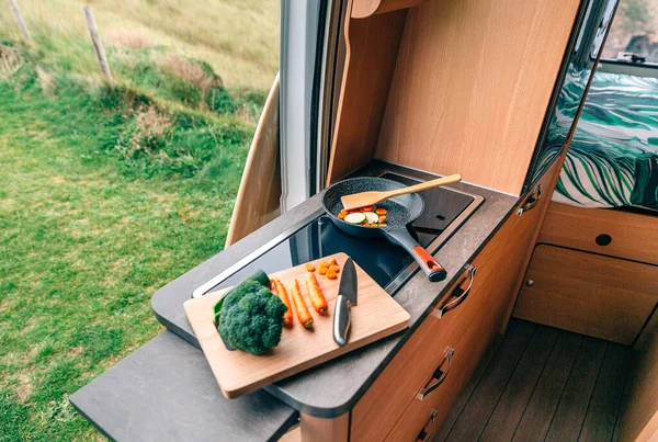 Vegan meal preparation in a camper van