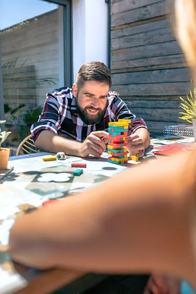 Concentrated Bearded Man Catching Jenga Game Piece His Female Office — Stock Photo, Image