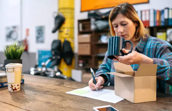 Blonde Woman Entrepreneur Checking New Merchandise Received Courier Sell Her Stock Photo
