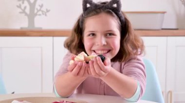 Child with coals for the Befana holiday. A happy little girl is waiting for a gift for a traditional holiday in Italy on January 6th. High quality 4k footage