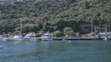 Small boat in the sea of sardinia. Luxury vacation. Embankment of Italy. travel on the waves. High quality 4k footage