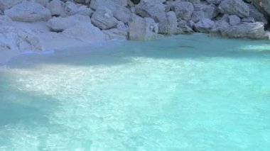 Small boat in the sea of sardinia. Luxury vacation. Embankment of Italy. travel on the waves. High quality 4k footage