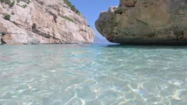 Blue beach in Sardinia. Italian coast, elite resorts. BLUE SKY AND CLEAR WATER. High quality 4k footage