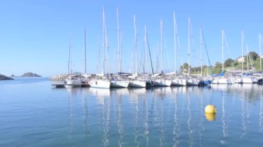 Small boat in the sea of sardinia. Luxury vacation. Embankment of Italy. travel on the waves. High quality 4k footage