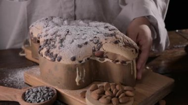 Colomba with chocolate. Easter Italian cake with almonds and chocolate in the shape of a dove. Festive pastries are traditional in Italy. High quality FullHD footage
