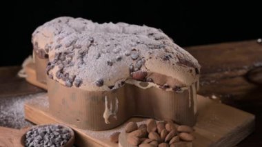 Colomba with chocolate. Easter Italian cake with almonds and chocolate in the shape of a dove. Festive pastries are traditional in Italy. High quality FullHD footage