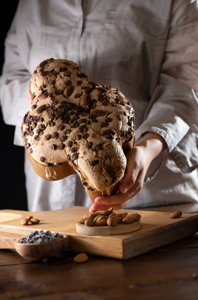 Colomba with chocolate. Easter Italian cake with almonds and chocolate in the shape of a dove. Festive pastries are traditional in Italy. 