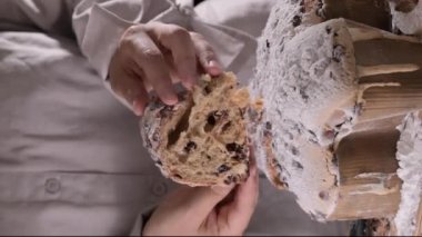 Colomba with chocolate. Easter Italian cake with almonds and chocolate in the shape of a dove. Festive pastries are traditional in Italy. High quality FullHD footage