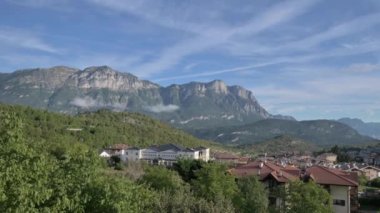 Panorama of Trento. Mountains, clouds, green forests and hiking trails. High quality photo