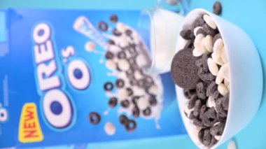 Oreo Flavored Breakfast Cereal, black and white dry breakfast rings. Cup with delicious breakfast and milk. High quality FullHD footage