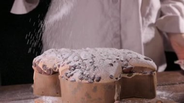 Colomba with chocolate. Easter Italian cake with almonds and chocolate in the shape of a dove. Festive pastries are traditional in Italy. High quality FullHD footage