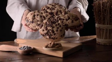 Colomba with chocolate. Easter Italian cake with almonds and chocolate in the shape of a dove. Festive pastries are traditional in Italy. 
