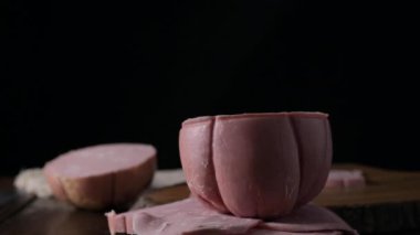 Mortadella. Traditional pork sausage with pistachios or black pepper. Italian delicacy from Bologna. High quality 4k footage