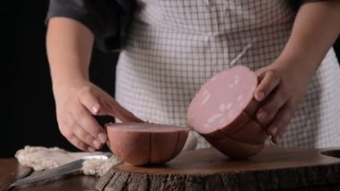 Mortadella. Traditional pork sausage with pistachios or black pepper. Italian delicacy from Bologna. High quality 4k footage