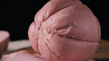 Mortadella. Traditional pork sausage with pistachios or black pepper. Italian delicacy from Bologna. High quality 4k footage