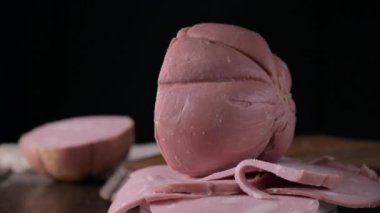 Mortadella. Traditional pork sausage with pistachios or black pepper. Italian delicacy from Bologna. High quality 4k footage