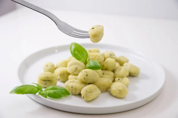 Italian gnocchi. Traditional Italian food. Handmade potato balls with parmesan and basil. Food for vegetarians and lovers of Italian typical cuisine. homemade pasta . High quality
