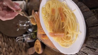 Spaghetti with bottarga. Typical Sardinian Cuisine. A dish with traditional Italian pasta from the South, dried sardine roe, lemon and pasta. High quality 4k footage