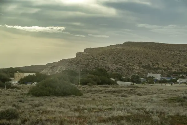 stock image Steepe landscape environmet with few home buildings, puerto piramides town, biedma department, puerto madryn, chubut province, argentina