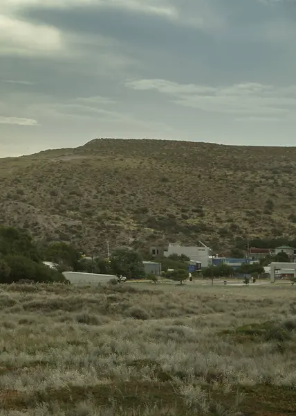 stock image Steepe landscape environmet with few home buildings, puerto piramides town, biedma department, puerto madryn, chubut province, argentina