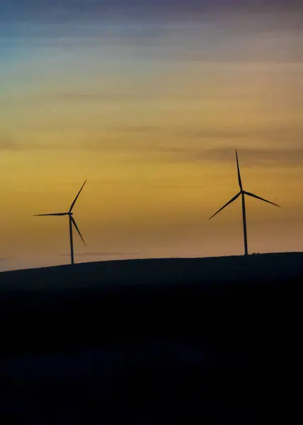 stock image Windmills at steppen high contrast silhouette landscape, viedma department, chubut province, argentina