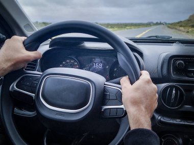 Inside car shot depicting a person driving at extreme high speed velocity clipart