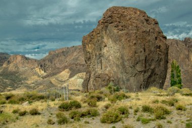 Patagonia landscape showing the famous piedra parada, a striking natural rock formation formed by ancient volcanic activity located in patagonia, chubut province, argentina  clipart