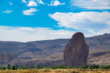 Patagonia landscape showing the famous piedra parada, a striking natural rock formation formed by ancient volcanic activity located in patagonia, chubut province, argentina  clipart