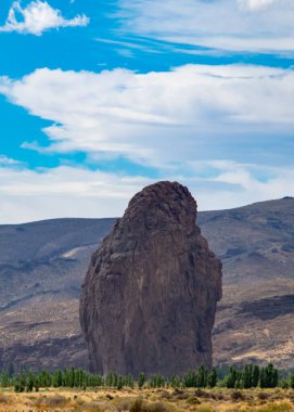 Patagonia landscape showing the famous piedra parada, a striking natural rock formation formed by ancient volcanic activity located in patagonia, chubut province, argentina  clipart