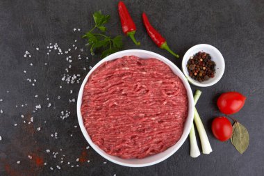Fresh pork and beef minced meat on a black