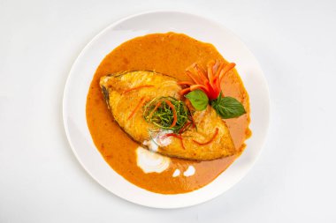 Deep-Fried King Mackerel with Choo Chee Curry. clipart