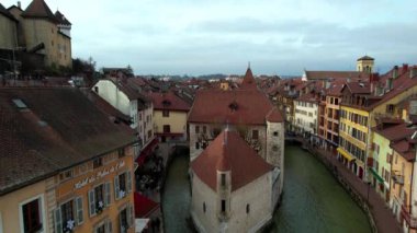 France travel and landmarks. Romantic beautiful old town of Annecy aerial drone view with medieval castle. Haute-Savoi region