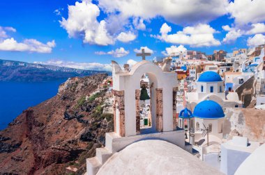 Santorini,  Oia village, Cyclades . Greece. Iconic view with blue domes and caldera of most beautiful island