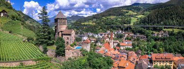 Scenic beautiful places of northern Italy. Charming village Chiusa . panoramic arerial view with medieval castle Branzoll.  South Tyrol, Bolzano province clipart