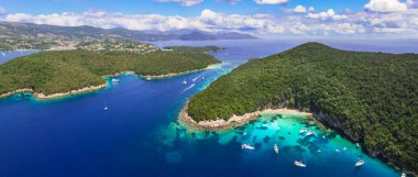 Sivota - stunning aerial drone video of turquoise sea known as Blue Lagoon and white sandy beaches. Epirus, Greece summer holiday clipart