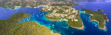 Sivota - stunning aerial drone video of turquoise sea known as Blue Lagoon and white sandy beaches. Epirus, Greece summer holidays clipart