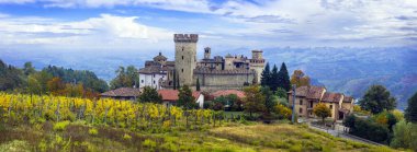 Medieval scenic villages and castles of Italy -Vigoleno with autumn vineyards in Emilia-Romagna region clipart