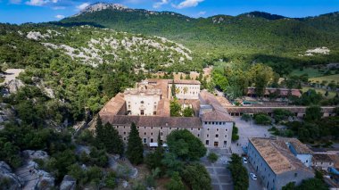 Landmarks of Mallorca (Majorca) island Spain-sanctuary and monastery Lluc. aerial panoramic view clipart