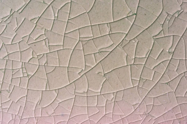Close up to background and texture of stretch marks cracked on white cream glazed tile. Scratches background. Vintage scratched grunge tile broken screen texture. Scratched glass surface wallpaper.
