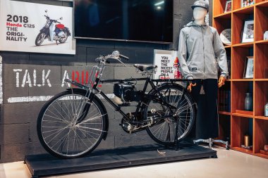 NAKHON PATHOM,THAILAND-JANUARY 7, 2023 : Beautiful antique black classic Honda with engine components in good condition preserved item on display at CUB House Nakhon Pathom Honda x Greyhound Coffee.