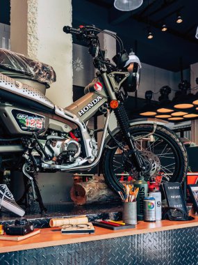 NAKHON PATHOM,THAILAND-JANUARY 7, 2023 : View of Honda Super Cub C 125 Motorcycle classic 125cc. collection on display for sale at CUB House Nakhon Pathom Honda x Greyhound Coffee. Concept retro.