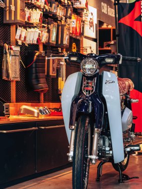 NAKHON PATHOM,THAILAND-JANUARY 7, 2023 : View of Honda Super Cub C 125 Motorcycle classic 125cc. collection on display for sale at CUB House Nakhon Pathom Honda x Greyhound Coffee. Concept retro.