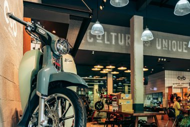 NAKHON PATHOM,THAILAND-JANUARY 7, 2023 : View of Honda Super Cub C 125 Motorcycle classic 125cc. collection on display for sale at CUB House Nakhon Pathom Honda x Greyhound Coffee. Concept retro.
