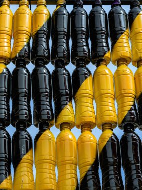 Beautiful wall made of multi colored recycled plastic bottles