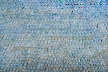 Beautiful wall made of recycled transparent plastic bottles