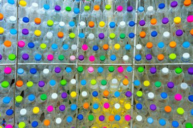 Beautiful wall made of multi colored recycled plastic bottles