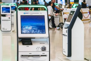 BANGKOK-THAILAND, FEBRUARY 20,2023 : Automated self check-in or self service machine at Suvarnabhumi International Airport. Innovation at the service of people, automation, staff reduction concept.