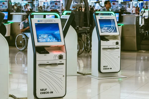 stock image BANGKOK-THAILAND, FEBRUARY 20,2023 : Automated self check-in or self service machine at Suvarnabhumi International Airport. Innovation at the service of people, automation, staff reduction concept.